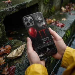 iPhone case featuring Pennywise the clown, a red balloon, and the quote Every fear floats to the surface in dark tones.!