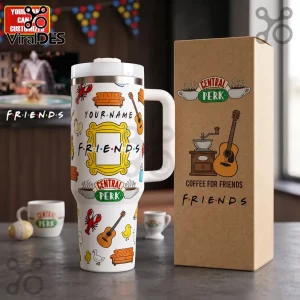 White stainless steel tumbler with Friends icons, yellow peephole frame, and custom name space next to a cardboard box.!