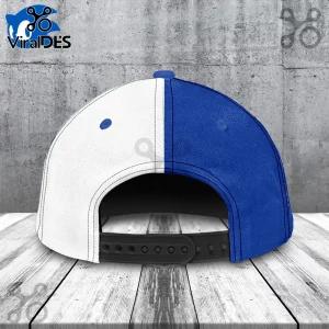 Split-design baseball cap with white left panel and royal blue right panel, featuring a black adjustable snapback strap.!