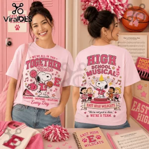 Snoopy x High School Musical Together Teacher pink t-shirt with Peanuts characters, musical notes, and East High logos.