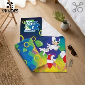 Sonic the Hedgehog fleece throw blanket with 35th anniversary logo, golden rings, and green chaos emerald graphic.!