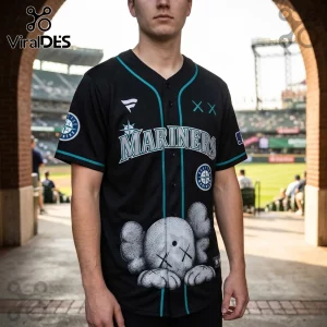 Black Seattle Mariners baseball jersey featuring a KAWS-style character graphic on the front and teal trim.!