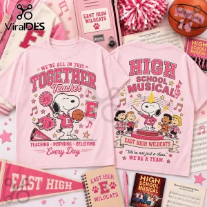 Snoopy x High School Musical Together Teacher pink t-shirt featuring Snoopy, Peanuts characters, and Wildcats branding.