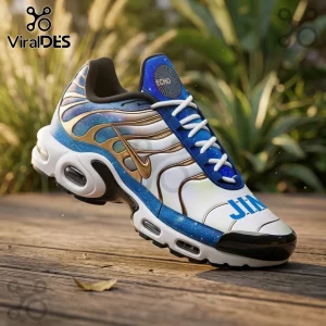 Jin BTS Galaxy Blue Air Max Plus sneakers featuring a nebula print, gold wave overlays, and white sole on a wood deck.
