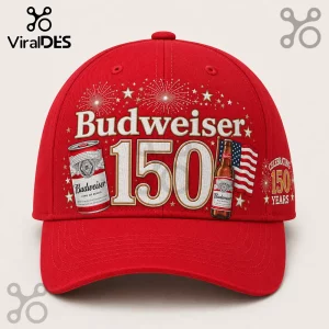 Budweiser 150th Anniversary red baseball cap with fireworks, a beer bottle, and commemorative text on the front panel.