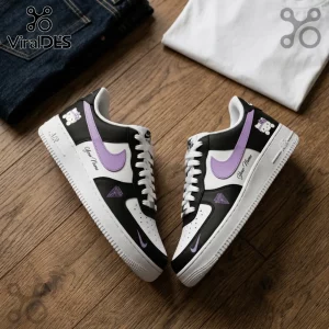 Golden State Valkyries Hello Kitty custom Nike Air Force 1 shoes with black, white, and purple accents on wood surface.