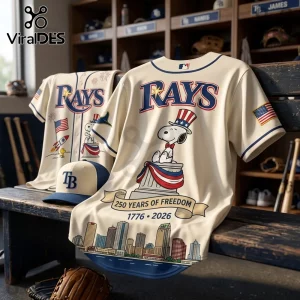 Cream-colored Tampa Bay Rays baseball jersey with Snoopy wearing a patriotic top hat and 250 Years of Freedom graphic.!