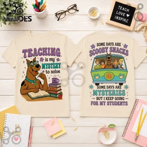Scooby-Doo Teacher Mystery Solved beige T-shirt showing Scooby-Doo as a teacher with books and the Mystery Machine crew.