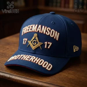 Freemason 1717 Embroidered Brotherhood baseball cap in navy blue with gold square and compass emblem on a wood table.