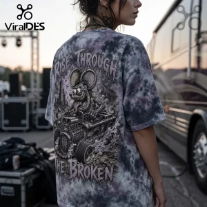 Grey and purple tie-dye t-shirt with back graphic of a cartoon rat driving a hot rod and the text Rise Through The Broken.!