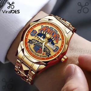 Gold-toned New York Knicks 2026 NBA Champions themed wristwatch with orange, blue, and metallic gold accents on a wrist.!