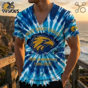 West Coast Eagles tie-dye blue and white distressed v-neck t-shirt with 40th anniversary 1986-2026 gold text graphic.!