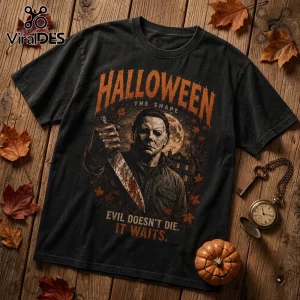 Michael Myers The Shape Halloween Horror T-Shirt featuring a masked killer, bloody knife, and full moon on black fabric.