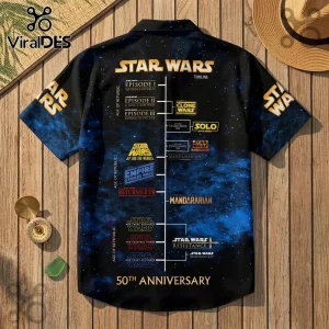 Black short-sleeve button-up shirt featuring a Star Wars timeline graphic with gold text and a blue space nebula print.!