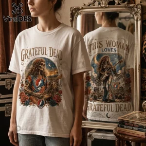Off-white crewneck t-shirt featuring Grateful Dead skeleton musician graphic with roses, stars, and script text.!