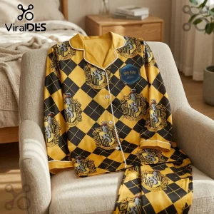 Hufflepuff yellow and black diamond pattern pajama set with Harry Potter crests on a beige armchair.!