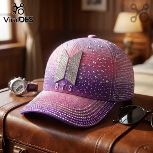 BTS Rhinestone Ombre Baseball Cap in purple and pink gradients with a central silver metallic logo on a leather trunk.