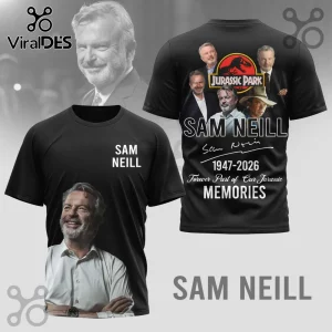 Black t-shirt featuring Sam Neill photo, Jurassic Park logo, 1947-2026 text, and Forever Part of Our Jurassic Memories.!