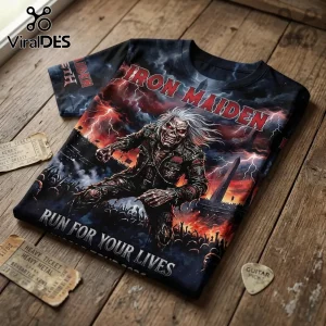 Iron Maiden graphic t-shirt featuring Eddie the mascot, lightning, and Run For Your Lives text on a wooden surface.!