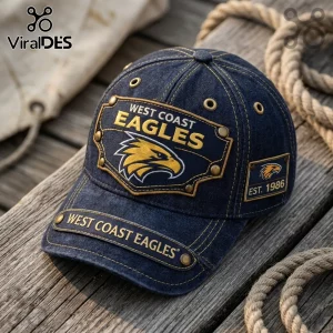 Dark blue denim baseball cap featuring West Coast Eagles logo embroidery, brass rivets, and Est. 1986 side patch detail.!