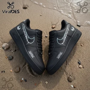 Black custom Air Force 1 sneakers with white gothic metal typography and crescent moon art on sandy beach background.!