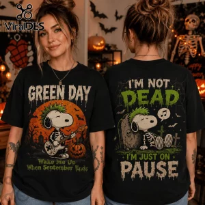 Green Day x Snoopy Halloween black t-shirt featuring Snoopy as a punk rocker with skeleton print and text design.