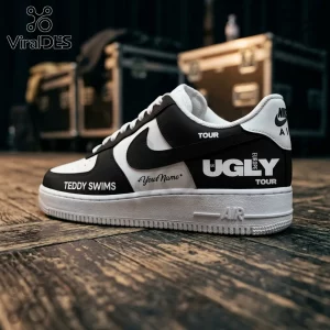 Teddy Swims The Ugly Tour 2026 Air Force 1 sneakers in black and white with custom tour branding on a wooden floor.