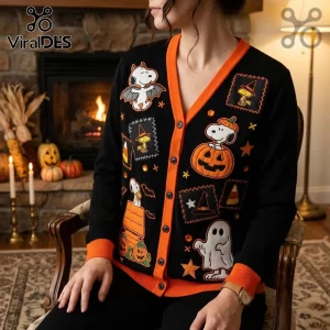 Black cardigan with orange trim featuring Snoopy and Woodstock embroidered patches in Halloween and pumpkin themes.!