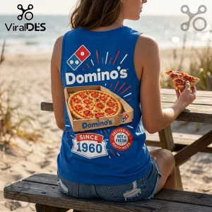 Domino's Pizza Since 1960 V-Neck Tank Top in blue featuring a pepperoni pizza graphic on the back at a beach.