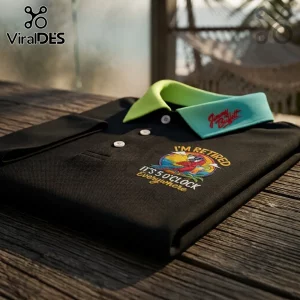 Jimmy Buffett It's 5 O'Clock Everywhere polo shirt in black with a bright green collar and embroidered parrot graphic.