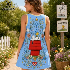 Snoopy and Woodstock on red doghouse graphic print blue tank dress with floral swirls and yellow trim.!
