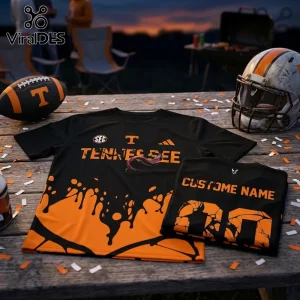 Black and orange Tennessee Volunteers football jerseys on a wooden table with a helmet and a football.!
