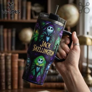 Stainless steel tumbler with stained glass style Jack Skellington print, black handle, clear lid, and metal straw.!