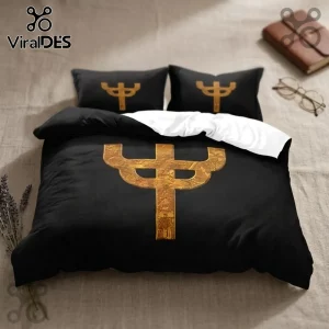 Black duvet cover and two pillowcases featuring a gold, intricate trident symbol with white underside fabric.!