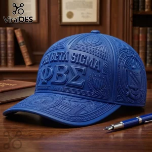 Royal blue Phi Beta Sigma baseball cap with embossed Greek letters and fraternity crest on a dark wooden office desk.!