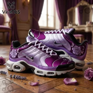 Purple Nike Air Max Plus sneakers featuring rose embroidery and metallic gradient finish on a wooden floor with flower petals.!
