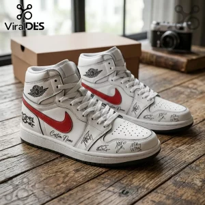 Custom high-top sneakers with white leather, red swooshes, My Chemical Romance text, and signatures on a wood table.!