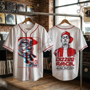 White baseball jerseys with red trim featuring Dizzee Rascal 2026 tour graphics in red and blue 3D style on wooden rack.!