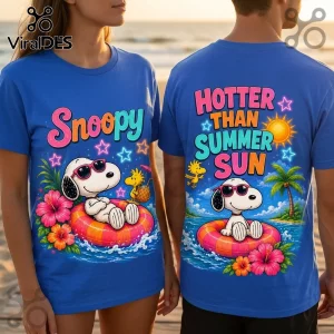 Blue cotton t-shirts featuring Snoopy in pink sunglasses on an orange pool float with hibiscus flowers and palm trees.!