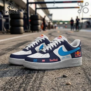 Red Bull Racing Formula One Nike Air Force 1 sneakers with white, navy, and sky blue accents on a race track background.