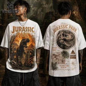 White oversized t-shirt featuring Jurassic Park T-Rex graphics, volcano art on front, and vintage map detail on back.!