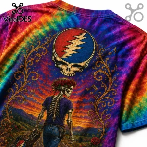 Tie-dye t-shirt featuring a Grateful Dead stealie logo above a skeleton wearing a flower crown and holding a guitar case.!