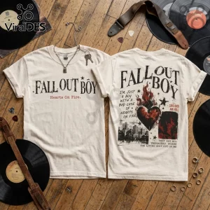 Cream-colored cotton t-shirt featuring Fall Out Boy text, a flaming heart graphic, and lyrics on a wooden floor background.!
