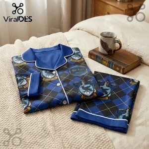 Harry Potter Ravenclaw pajama set in blue and black argyle print with house crests on a beige textured bedspread.!