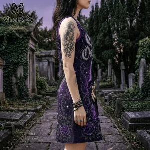 Woman wearing a sleeveless purple gothic dress with rose patterns and occult text standing in a cemetery.!