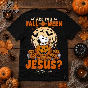 Snoopy Fall-O-Ween Jesus two-sided black T-shirt featuring Snoopy in a pumpkin, full moon, bats, and text on wood table.