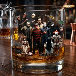 Whiskey glass filled with amber liquid and miniature horror movie icons including Freddy, Jason, and Pennywise figures.!
