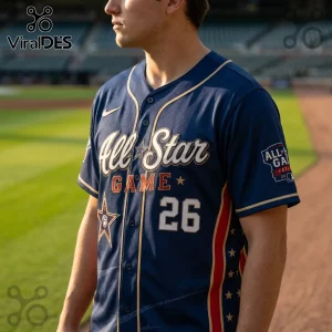 Navy blue MLB All-Star Game baseball jersey with gold trim, number 26, and star graphics worn by a man on a field.!