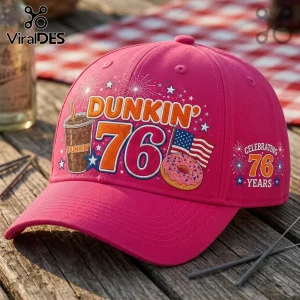 Dunkin Donuts 76th Anniversary pink baseball cap featuring iced coffee, a frosted donut, and an American flag graphic.