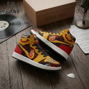 High-top sneakers featuring yellow, red, and black Guns N' Roses rock band graphics on a wooden surface with a record.!
